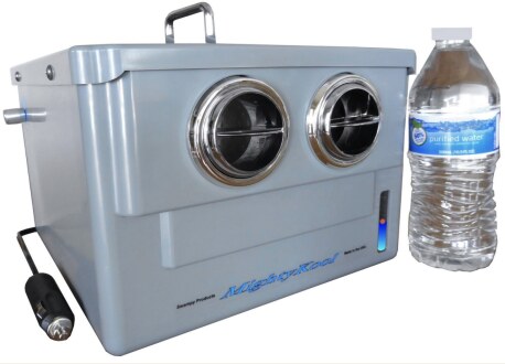 MightyKool Model K2 compact gray 12-volt evaporative cooler beside a water bottle